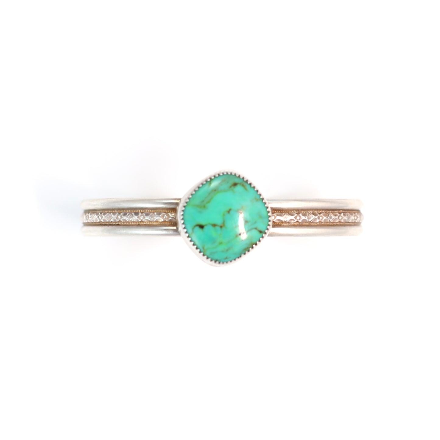 Faustite Green Gemstone set in a patterned oxidized sterling silver cuff. One of kind and handmade by Cara Carter Jewelry