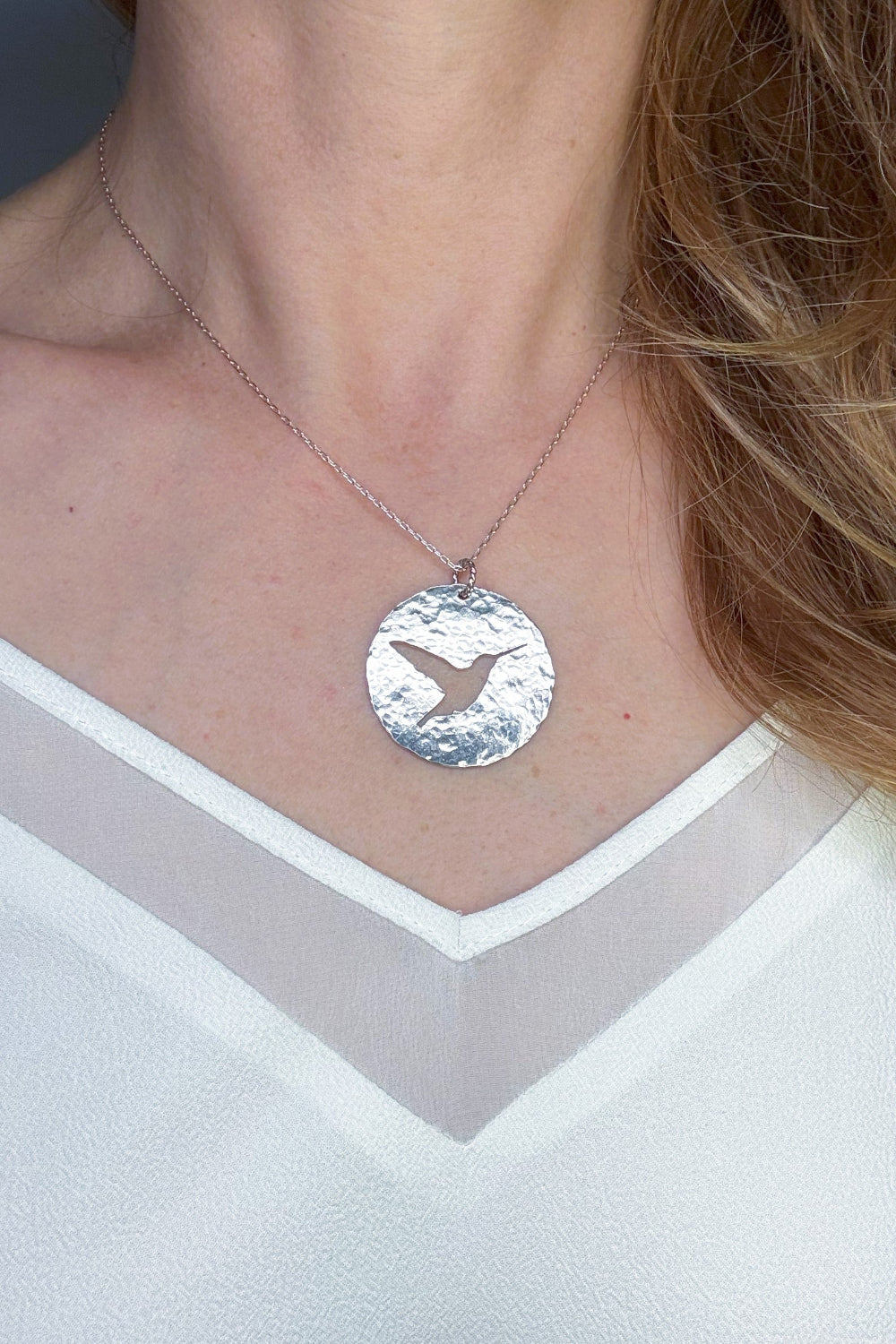 Hummingbird Silhouette Hand Pierced and Hammered Sterling Silver Circle Pendant Necklace shown on woman, for Nature and Bird Lovers