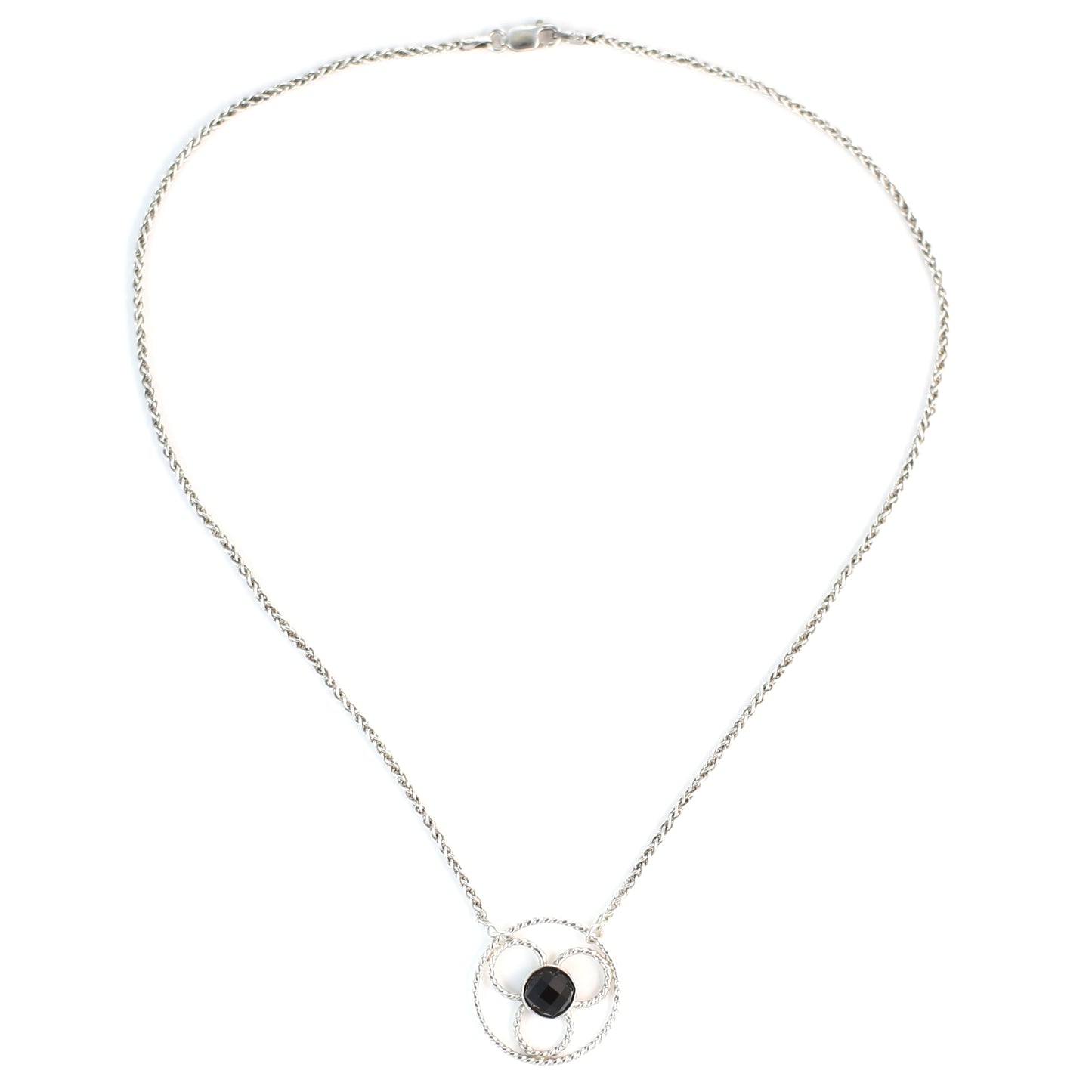 Faceted black onyx gemstone set in a stylized sterling silver floral design on a sterling silver wheat chain. Handmade by Cara Carter Jewelry