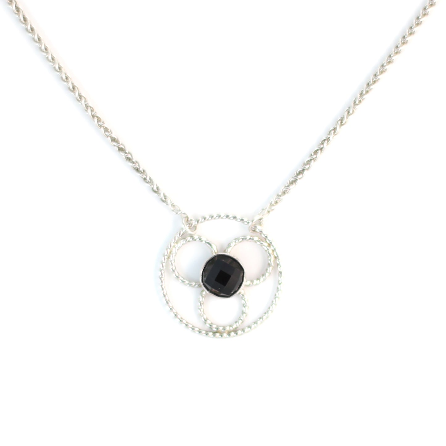 Faceted black onyx gemstone set in a stylized sterling silver floral design on a sterling silver wheat chain. Handmade by Cara Carter Jewelry