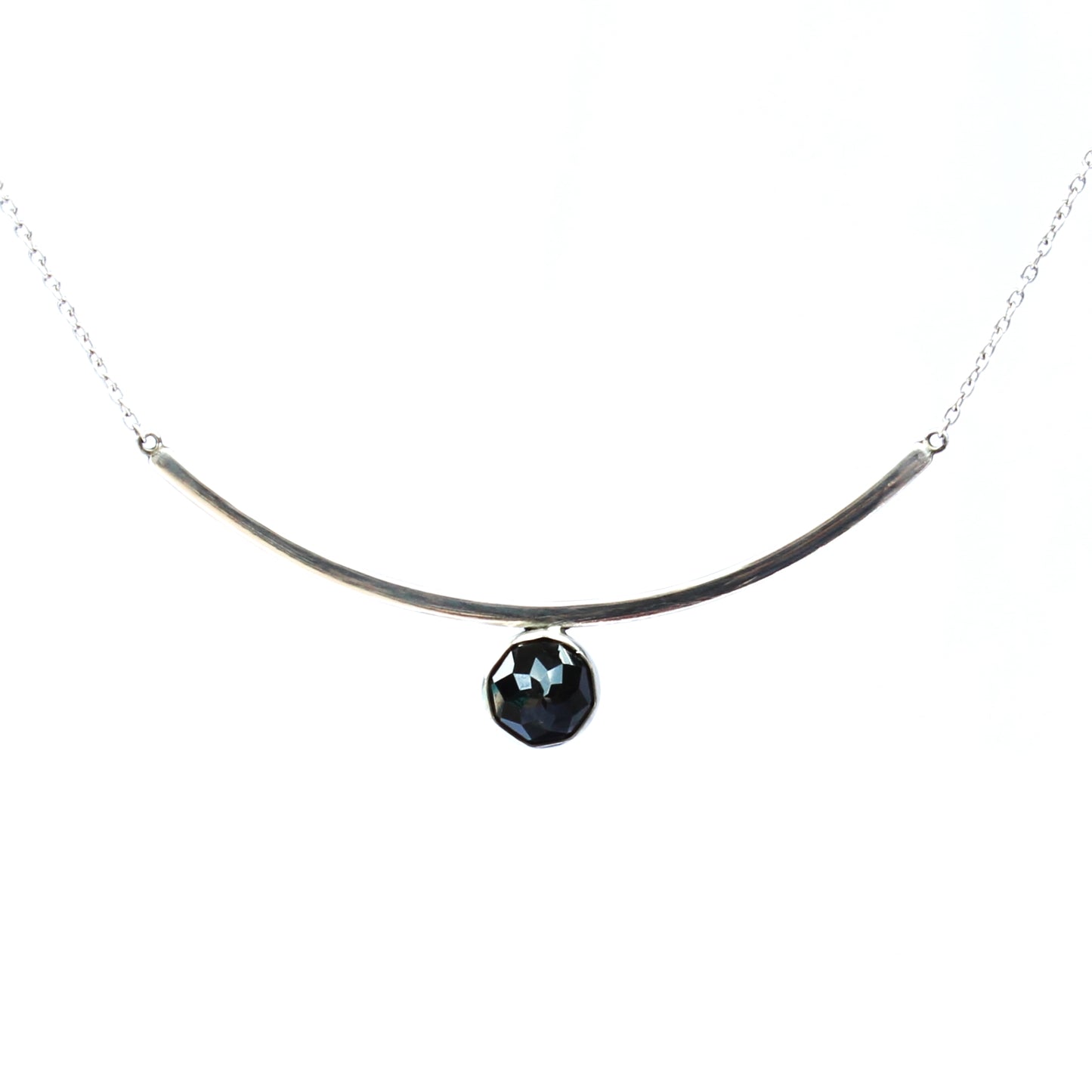 Black Spinel Faceted Gemstone on Minimalist Sterling Silver Curved Bar Necklace. Handmade by Cara Carter Jewelry