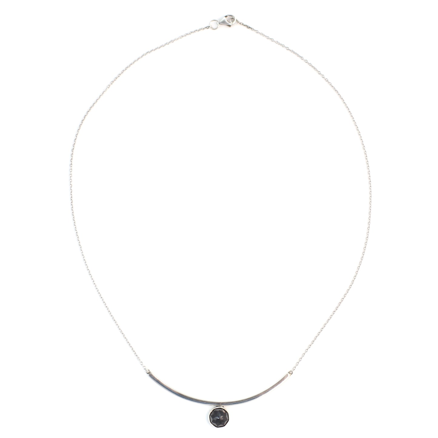 Black Spinel Faceted Gemstone on Minimalist Sterling Silver Curved Bar Necklace. Handmade by Cara Carter Jewelry