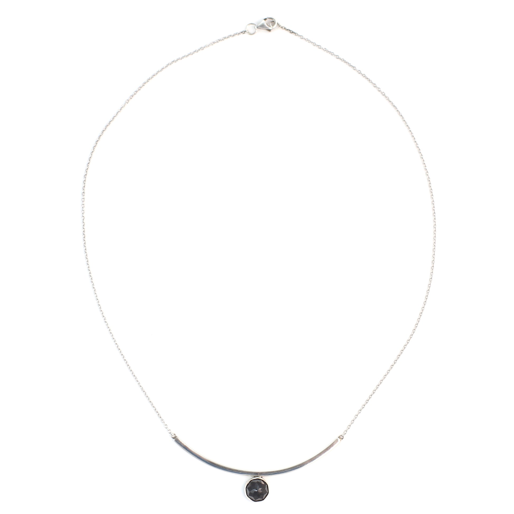 Black Spinel Faceted Gemstone on Minimalist Sterling Silver Curved Bar Necklace. Handmade by Cara Carter Jewelry