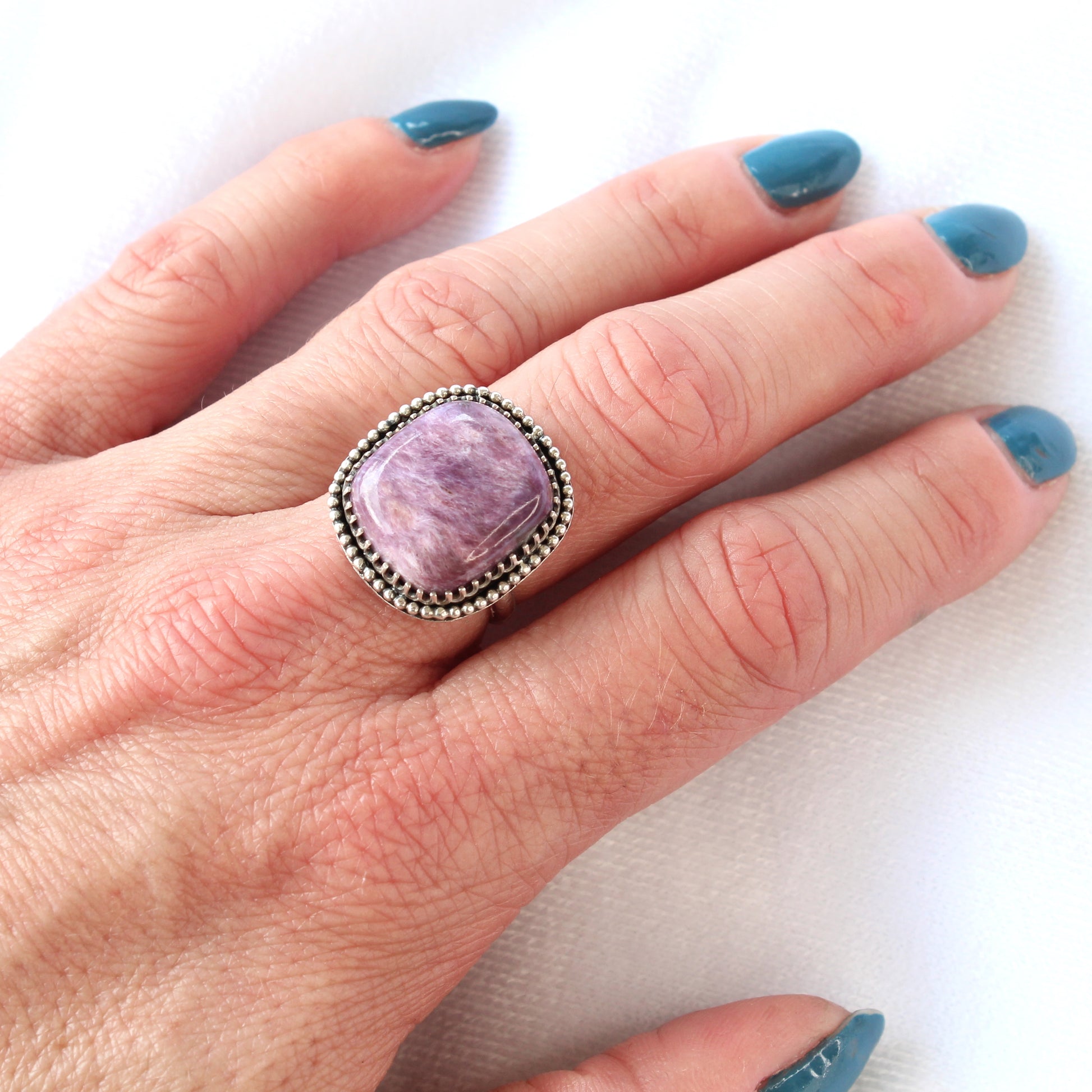 Purple Charoite Gemstone Ring set in Oxidized Sterling Silver with a Smooth Band and Beaded Details. Handmade by Cara Carter Jewelry