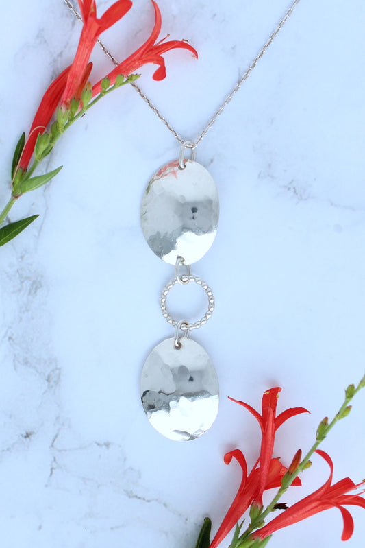Hammered Oval Shield and Beaded Circle Sterling Silver Pendant Necklace for Everyday Wear. Handmade by Cara Carter Jewelry