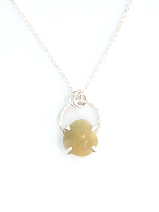 Handmade faceted yellow sapphire sterling silver pendant necklace in prong and halo setting.